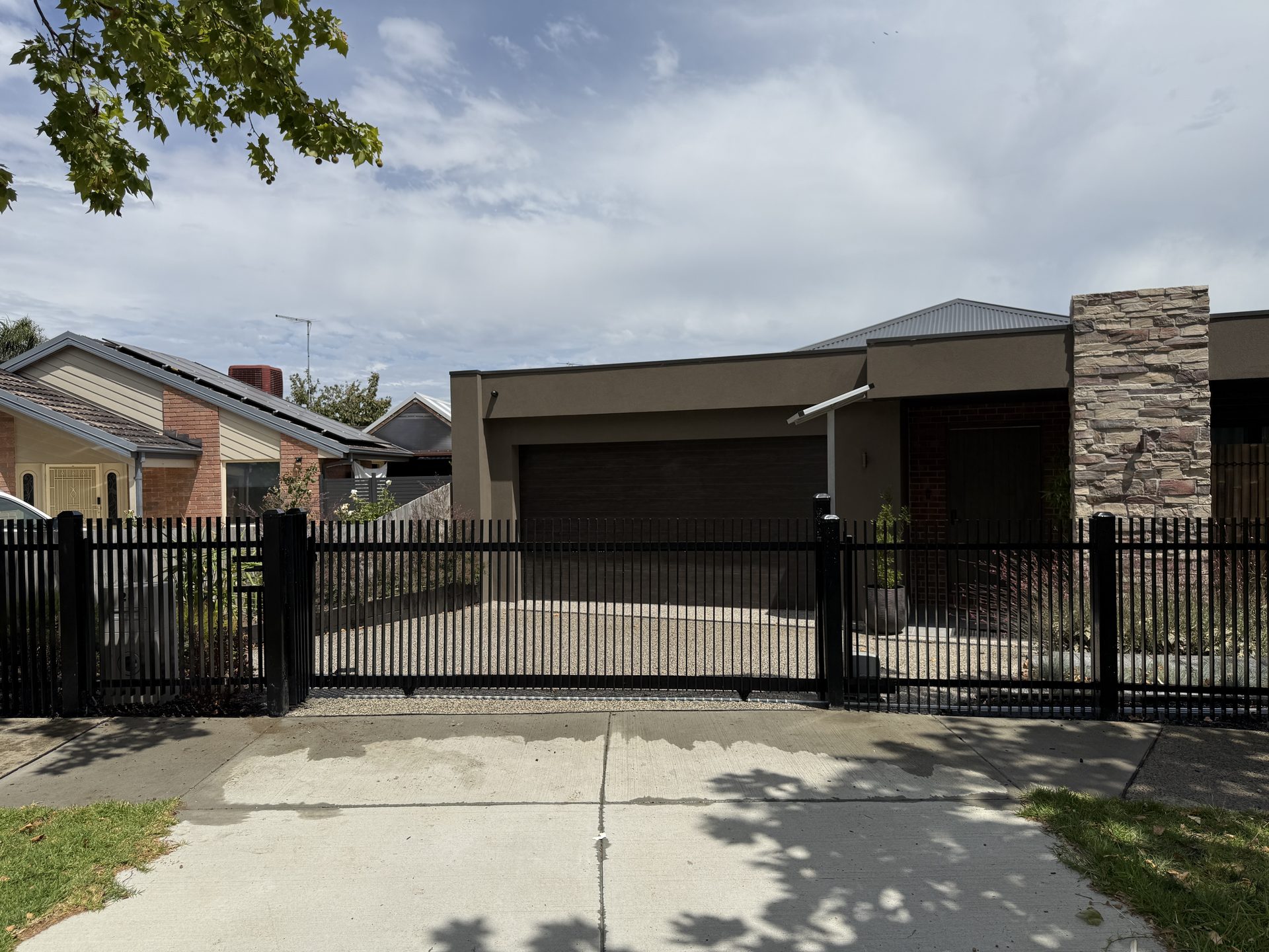 Black tubular automatic gate, Melbourne