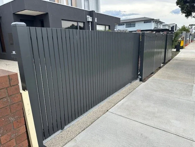 Dark grey aluminium slat sliding gate, Melbourne
