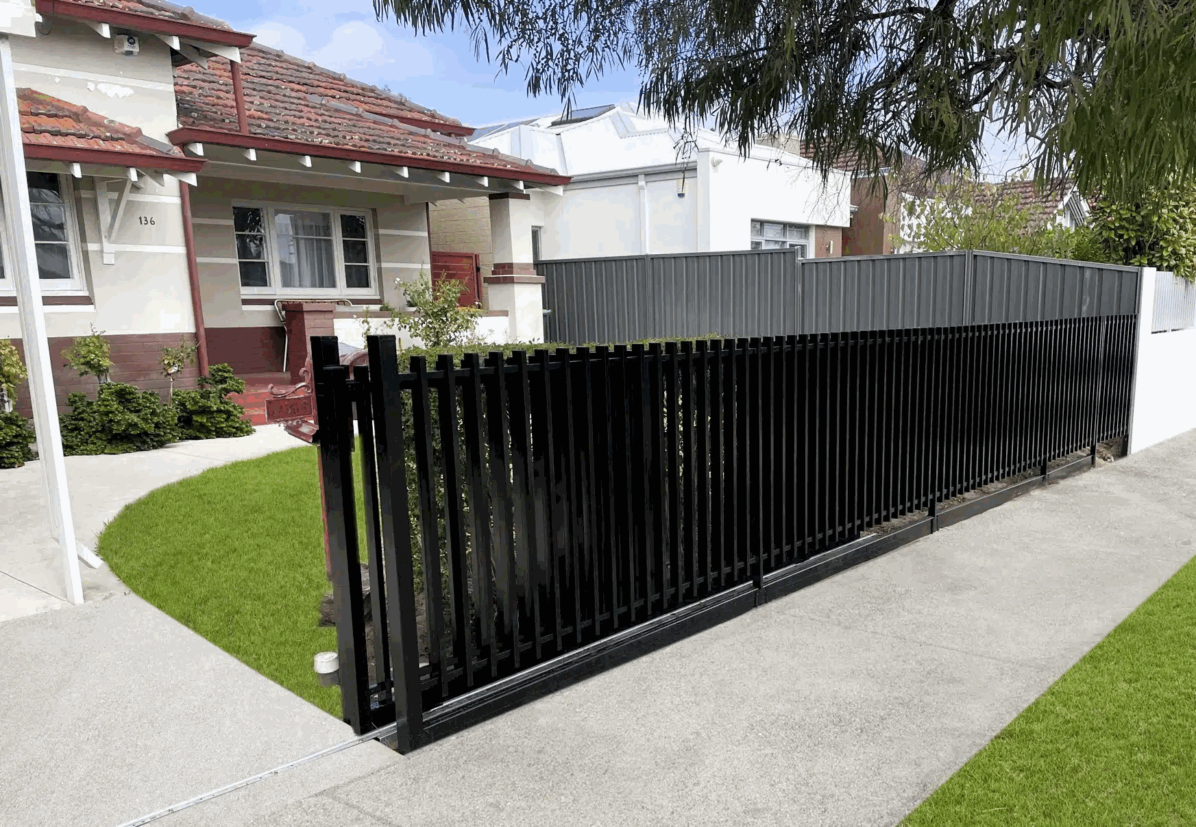 Black aluminium slat fence streetscape, Melbourne