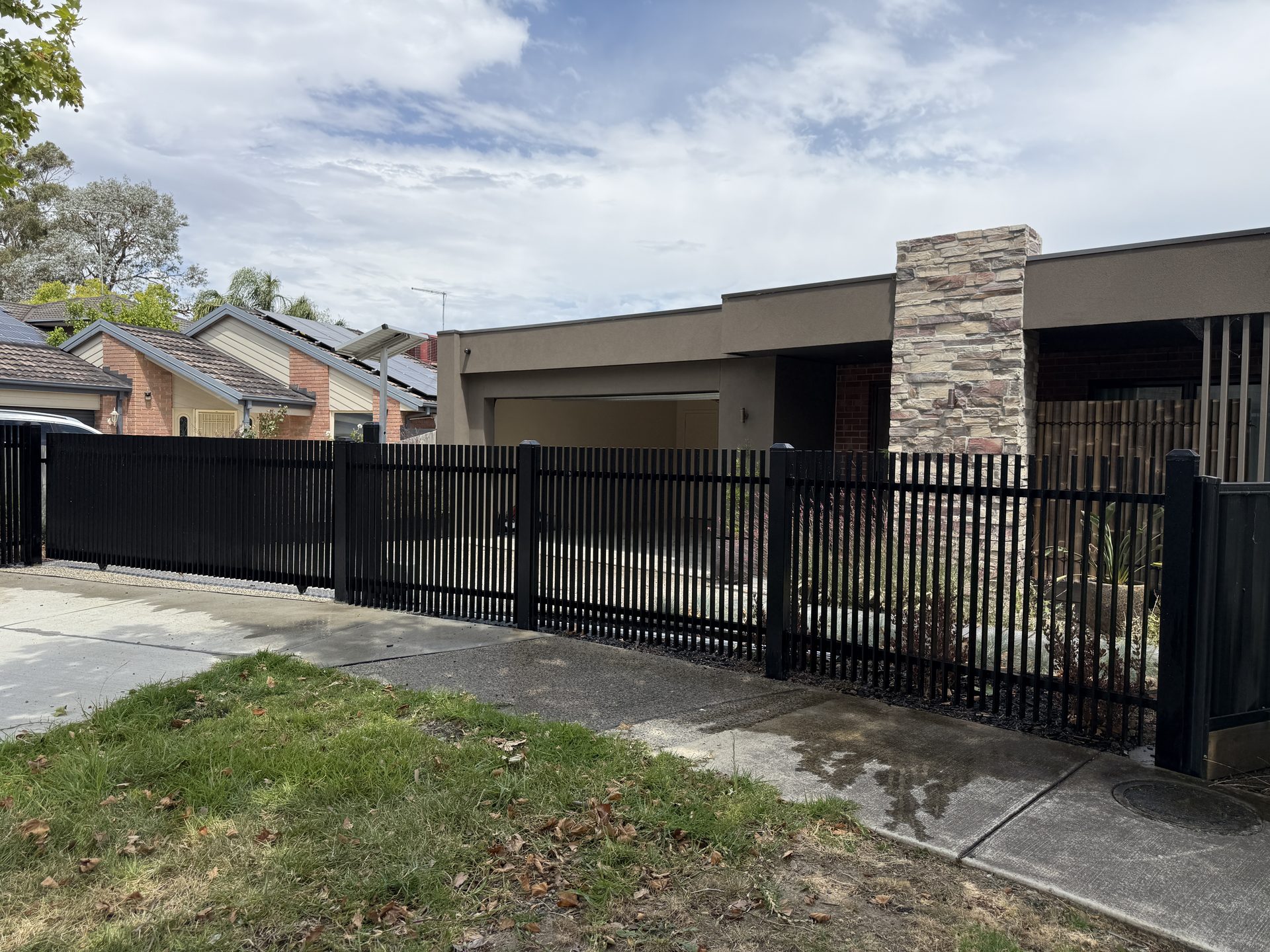 Black aluminium slat fence and gate, Melbourne