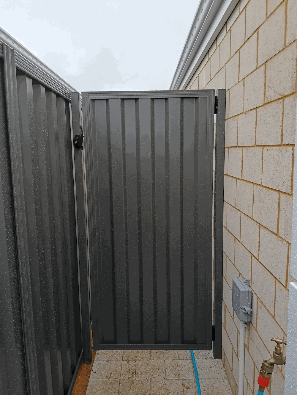 Charcoal Colorbond pedestrian gate matching fence, Melbourne