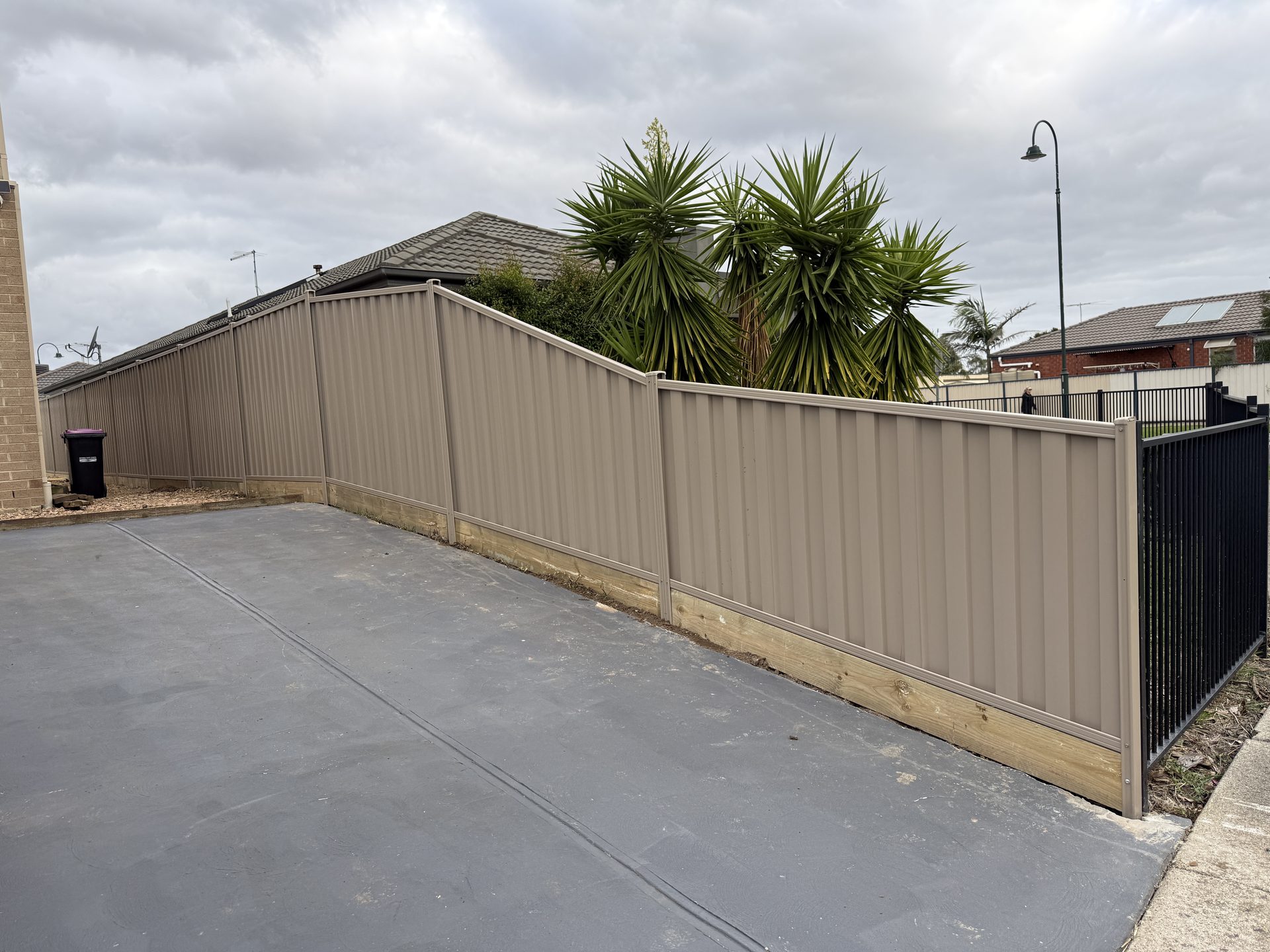 Beige Colorbond fence installation in Melbourne