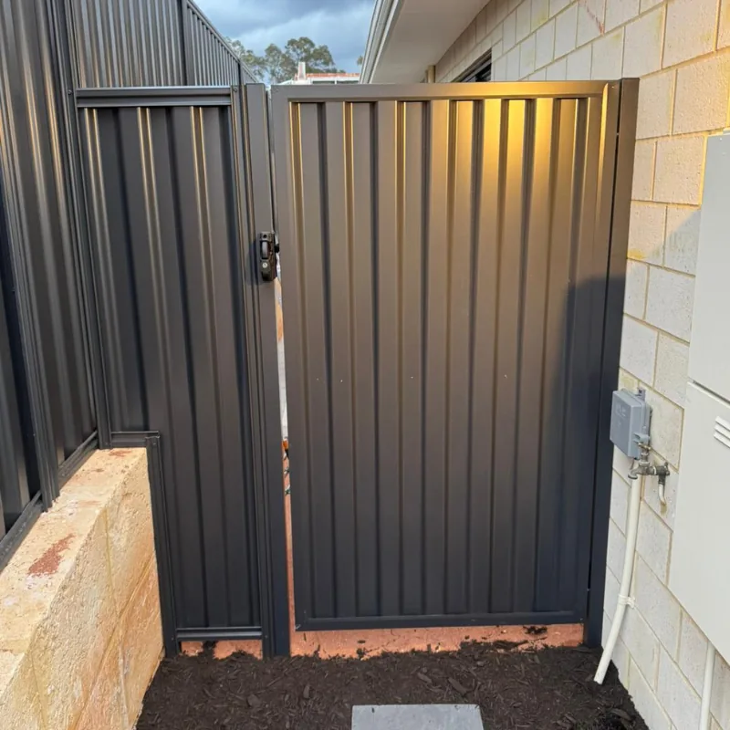 Charcoal Colorbond gate installed beside a Melbourne home